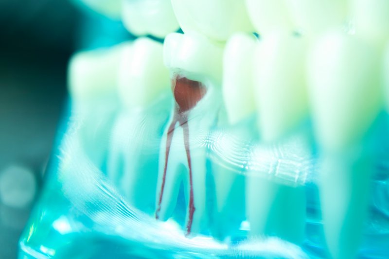 Smiling dental patient looking over her shoulder